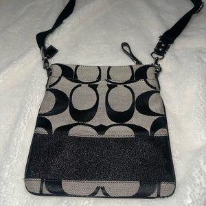 Coach Signature Gray and Black Monogrammed Crossbody Bag with Multiple Pockets.